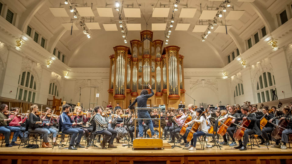 Rafael Payare conducting RCM Symphony Orchestra rehearsal in concert hall